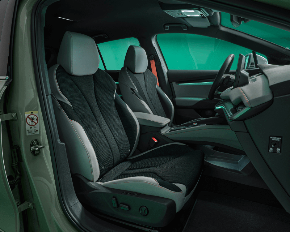 a close up of the car's front seats, unoccupied